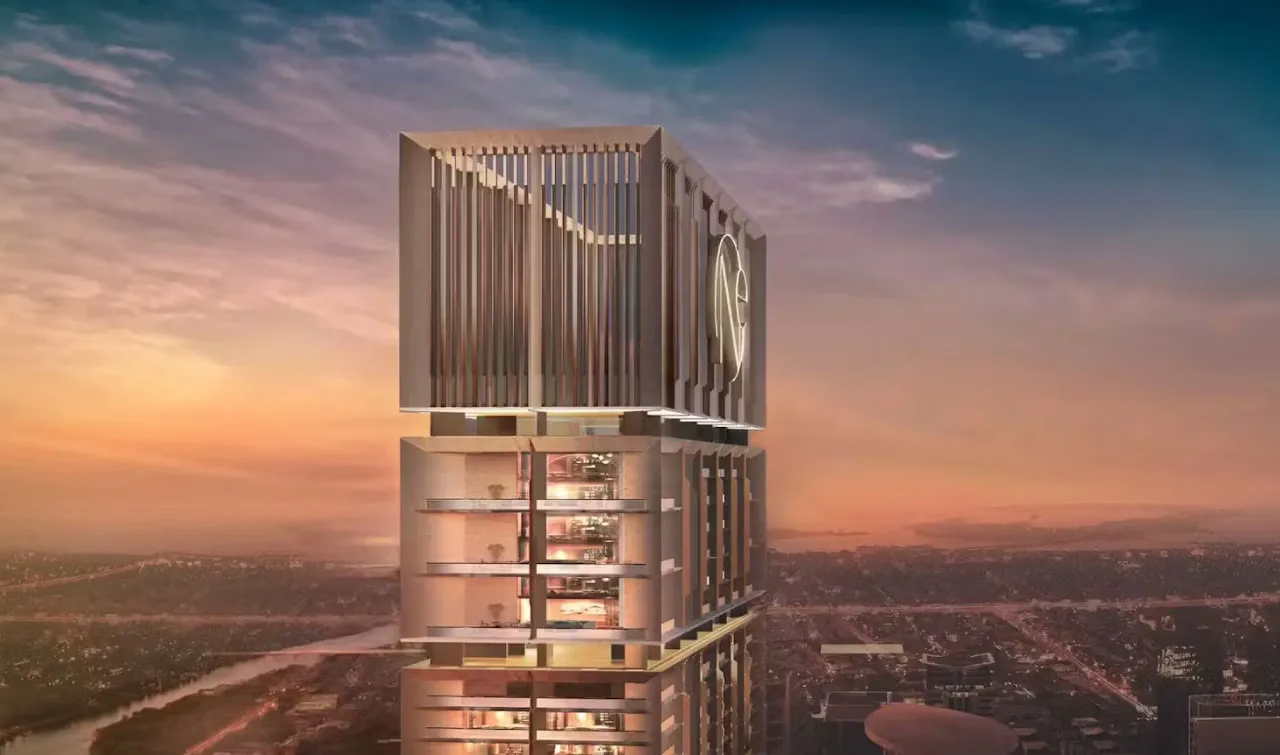 ONE by Binghatti: upper tower facade and rooftop structure at dusk — rendering