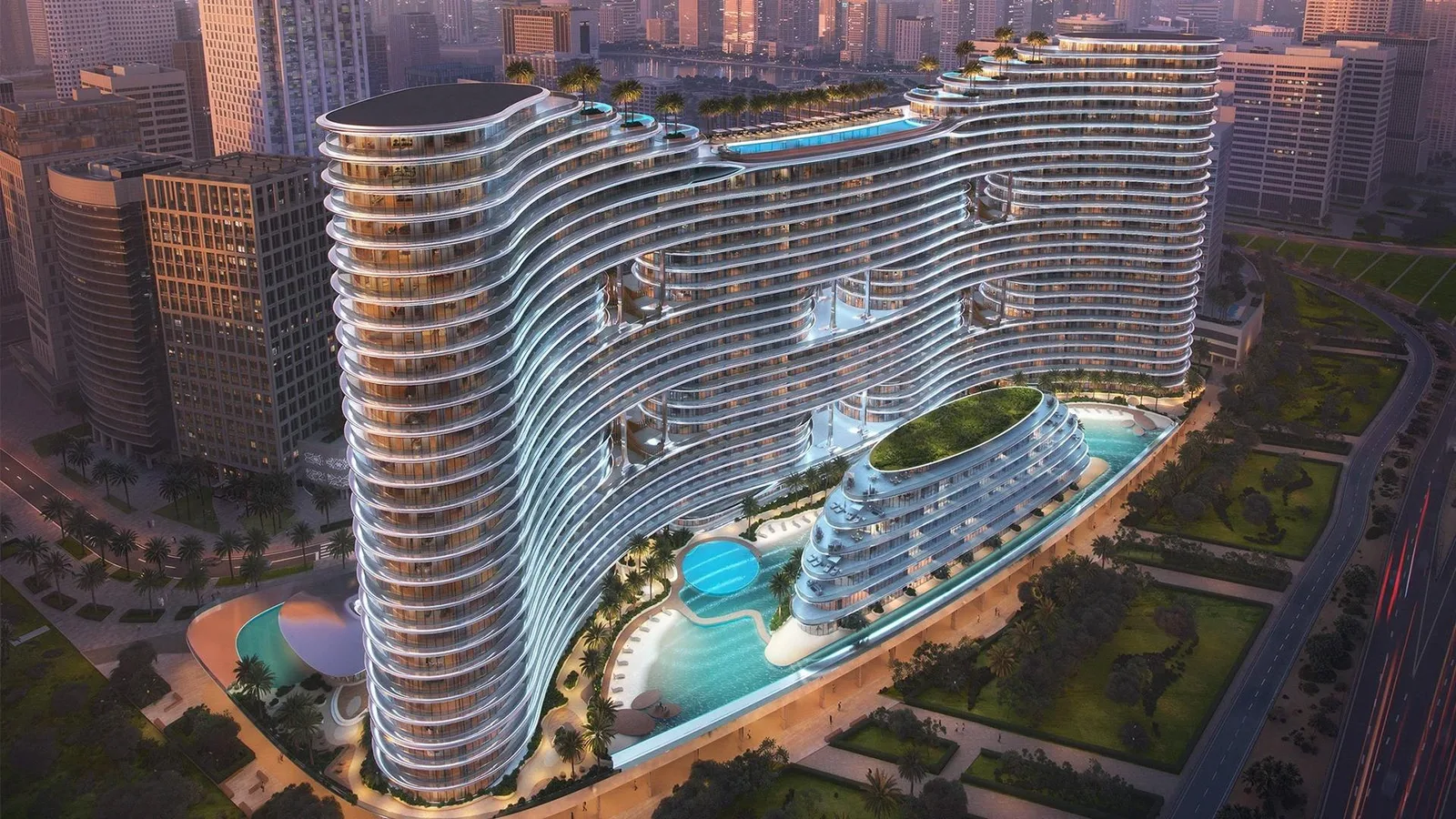 Binghatti Aquarise: Elevated view of Aquarise's curved facade and pool; official developer rendering