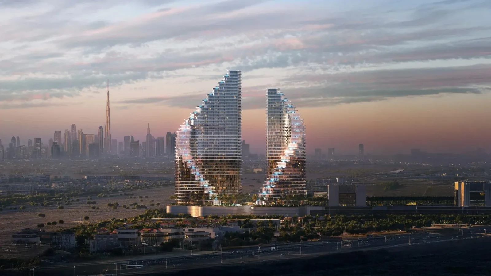 Binghatti Flare: Two sculptural residential towers at dusk; official developer rendering