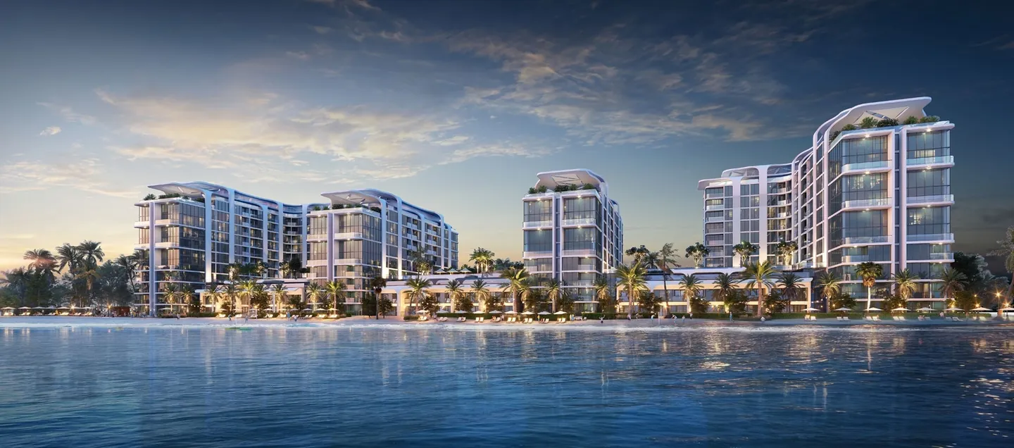 Coastline Beach Residences: Coastline waterfront at dusk — developer rendering