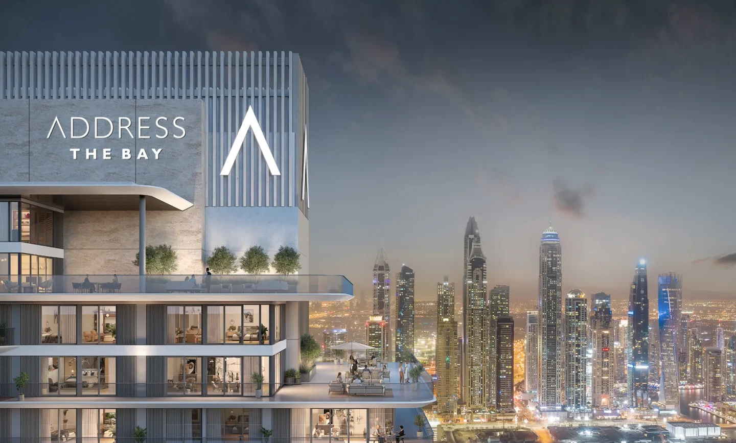 Address Residences The Bay: branded tower crown at night - developer rendering